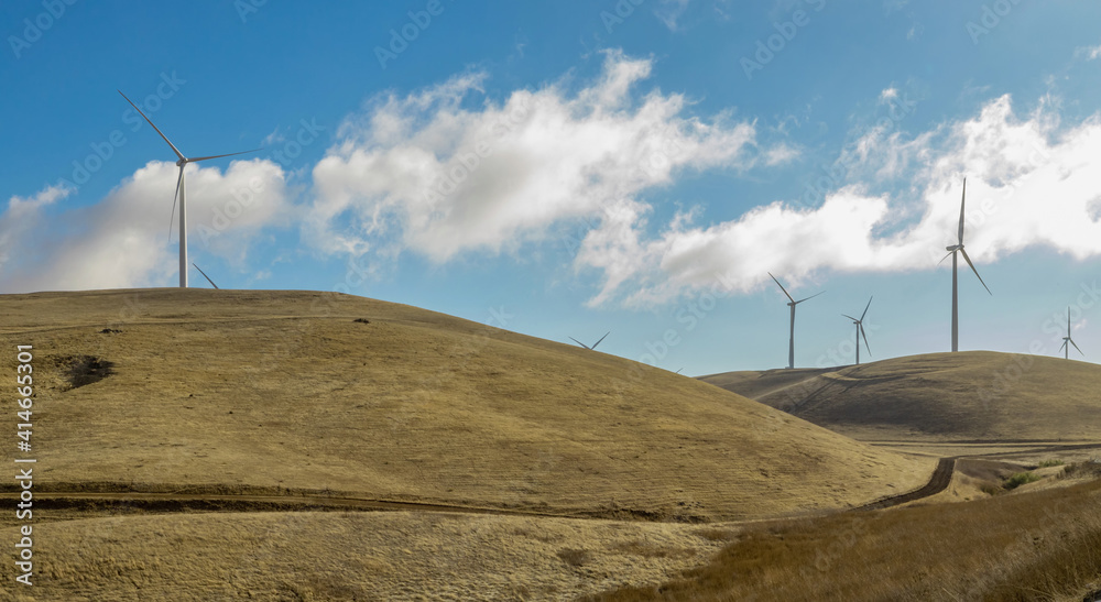 Wind farm in california, on the hills, summer, bright sunny weather with clouds. Concept, pure energ