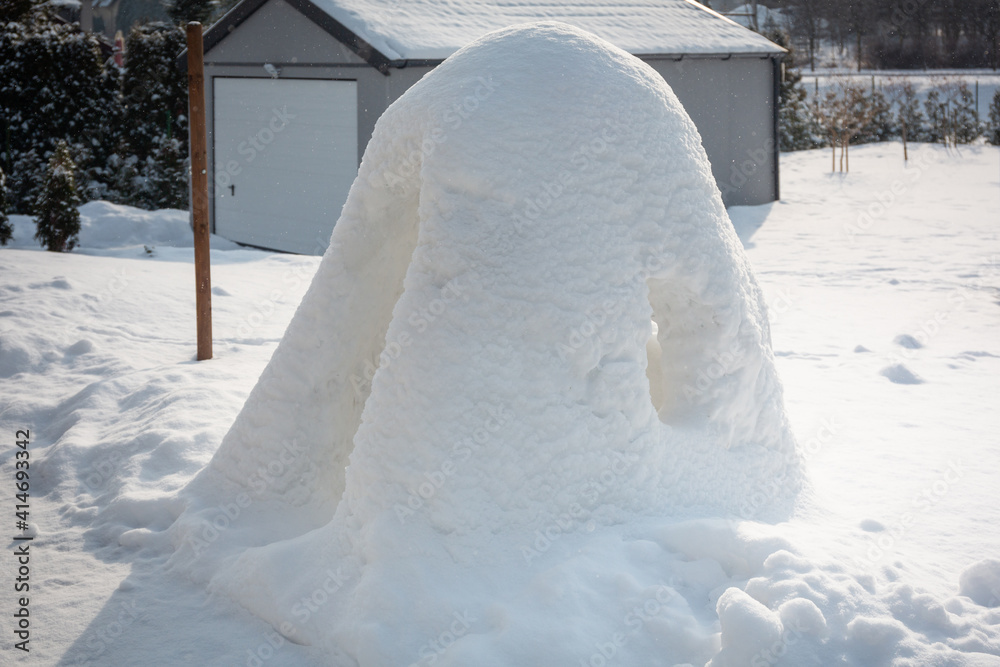 Beautiful winter garden with snow igloo at sunny day. Poland