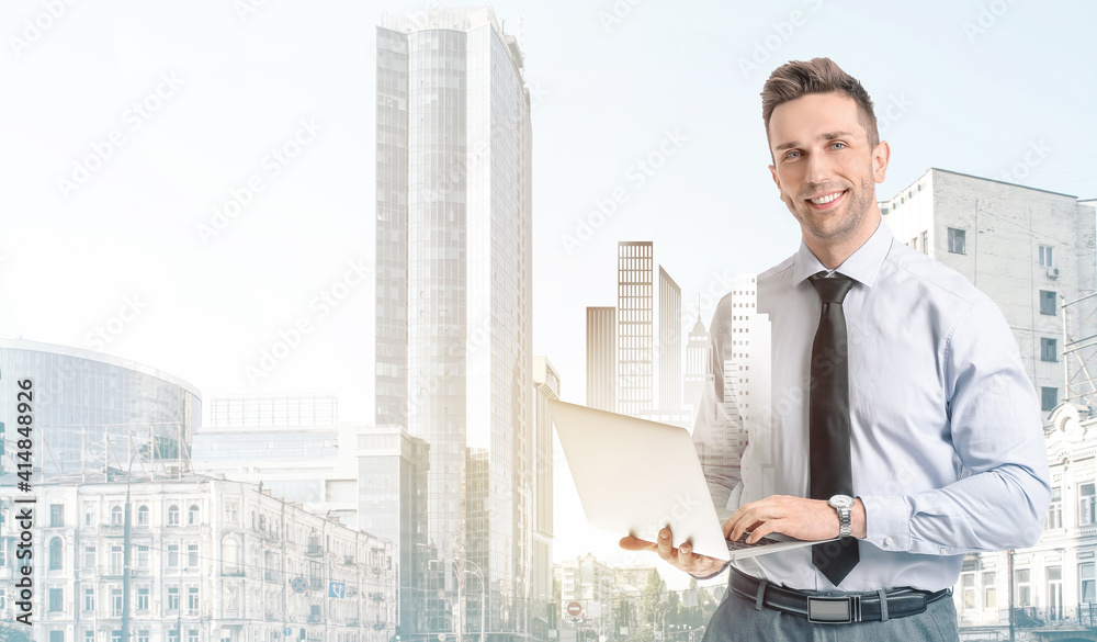 Portrait of handsome businessman with laptop on white background