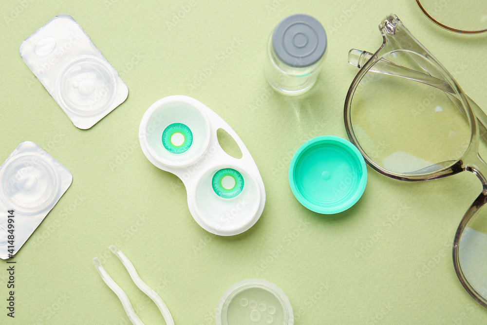 Composition with contact lenses and accessories on color background