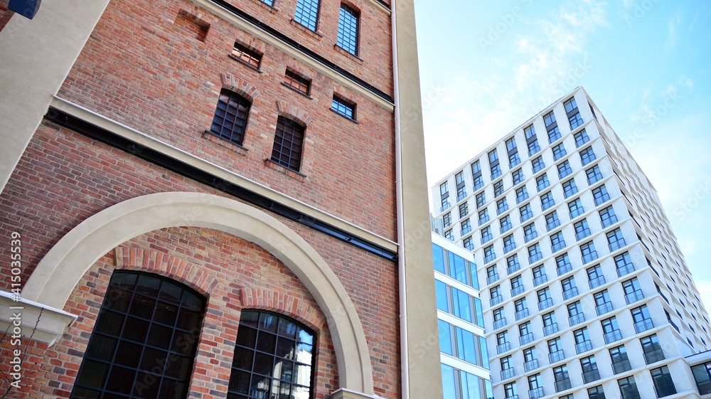 Revitalized red brick building and modern office building.