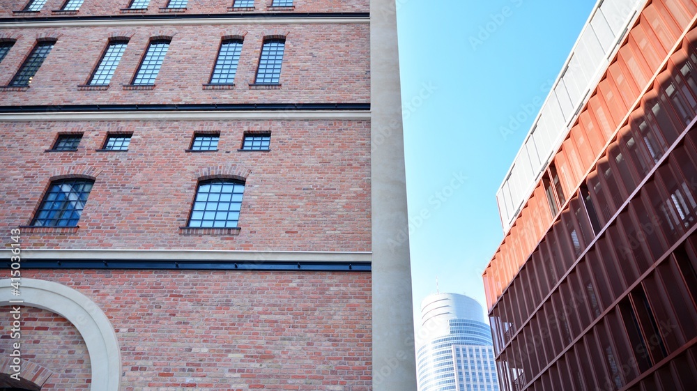 Revitalized red brick building and modern office building.