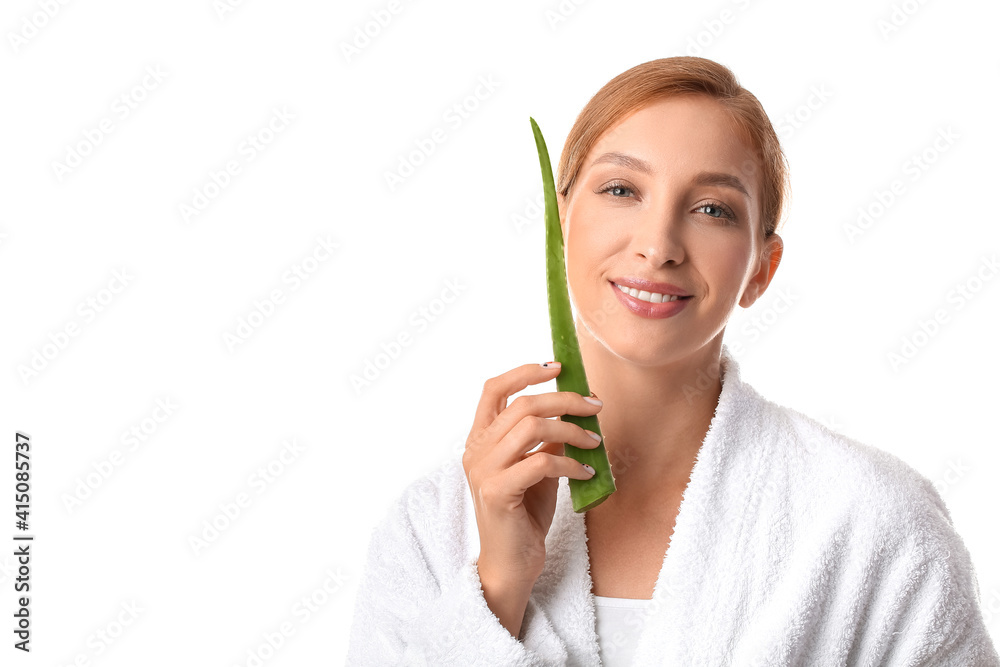 Beautiful young woman with aloe vera on white background