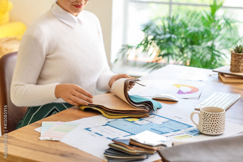 Female interior designer working in her office