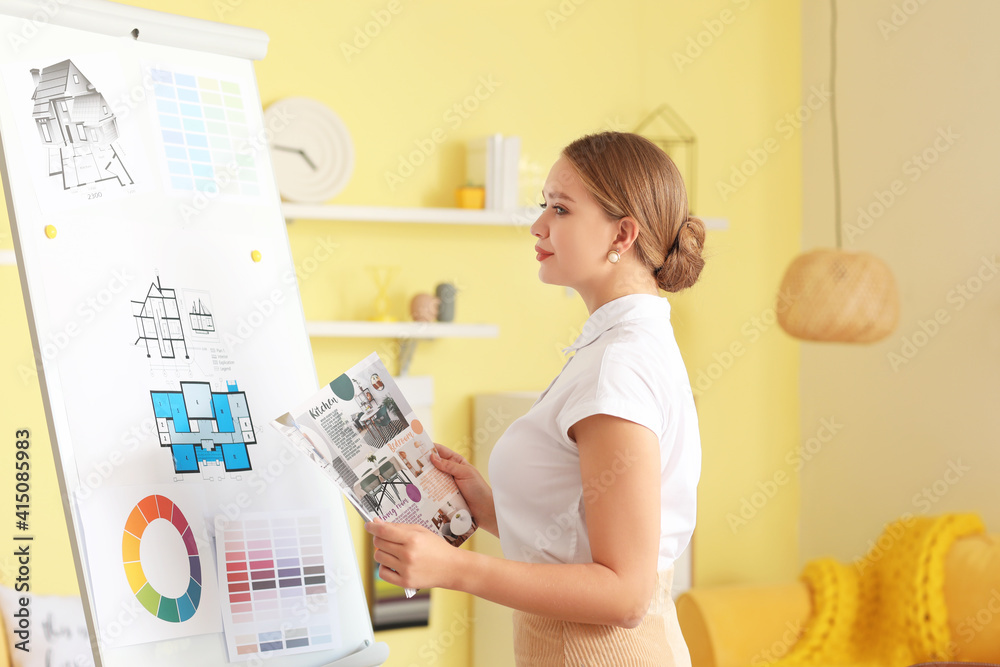 Female interior designer working in her office