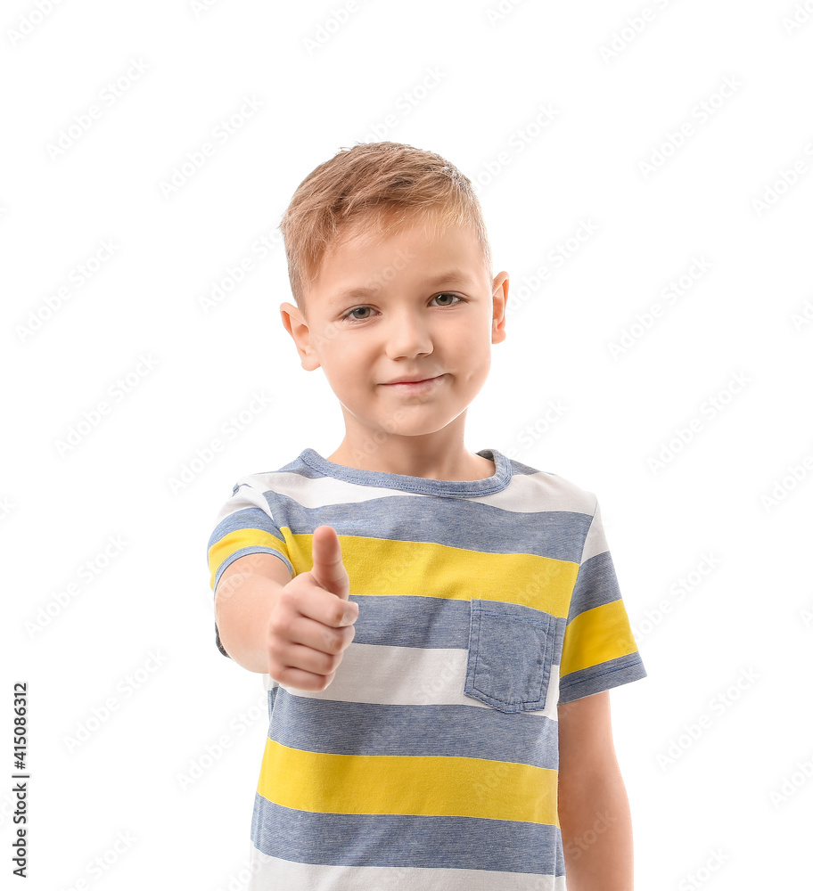 Cute little boy showing thumb-up on white background