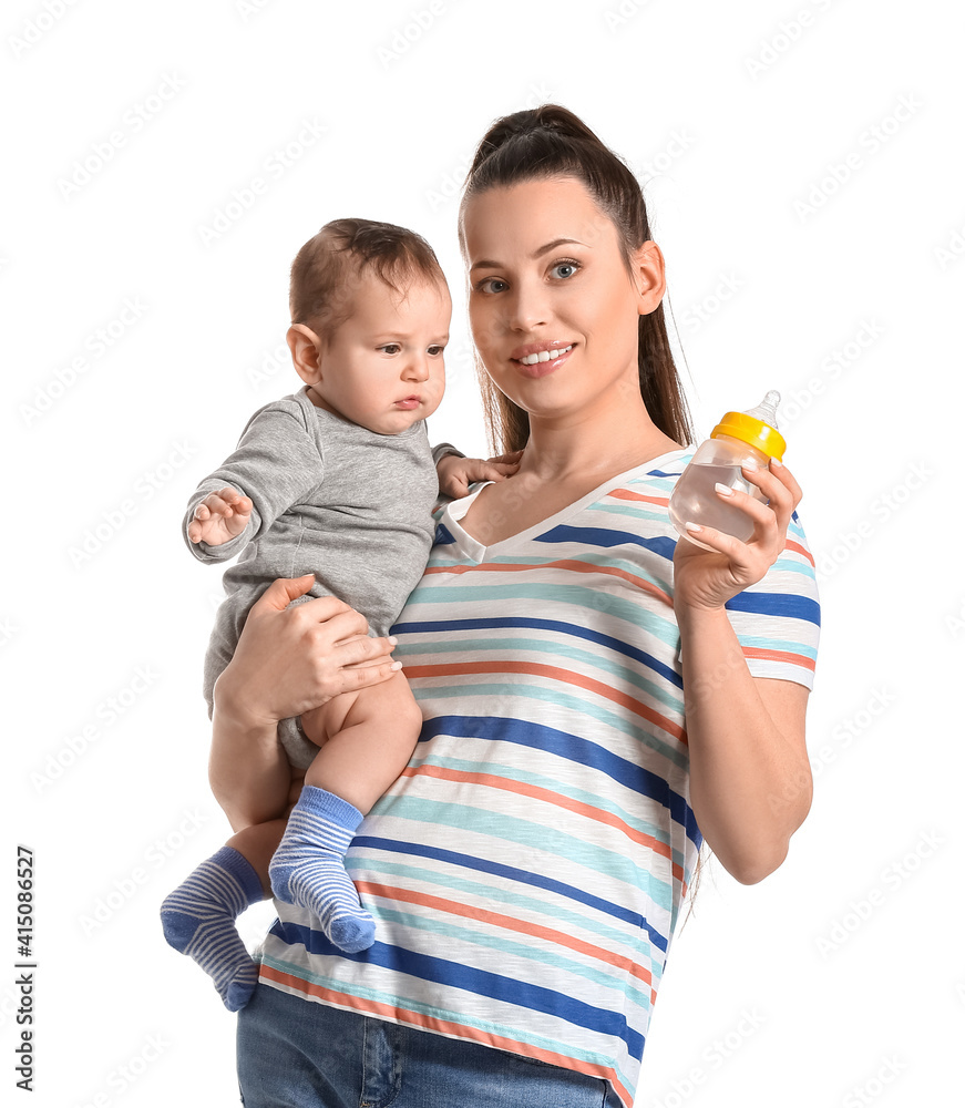 Young mother with cute baby boy and bottle of water on white background