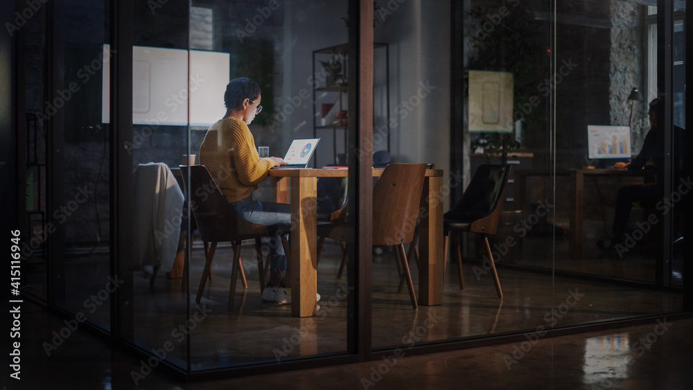 Young Latin Marketing Specialist with Short Hair in Glasses Working on Laptop Computer in Busy Creat