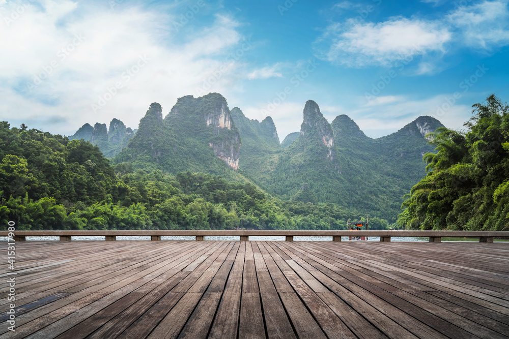 Wooden plank road and green mountains and green water natural landscape