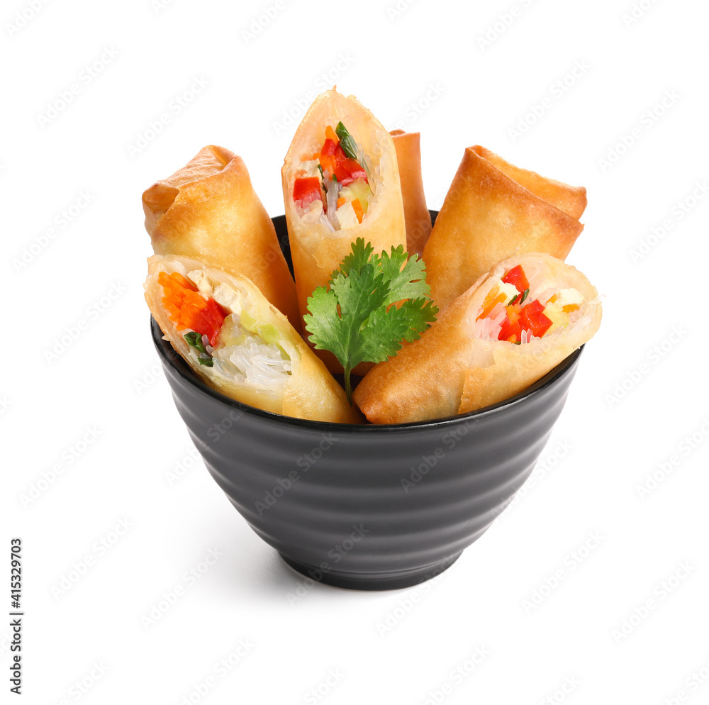 Bowl with tasty fried spring rolls on white background