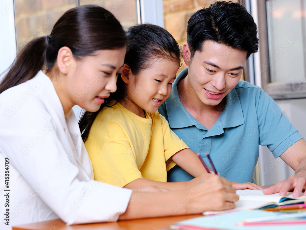 Happy family of three reading together