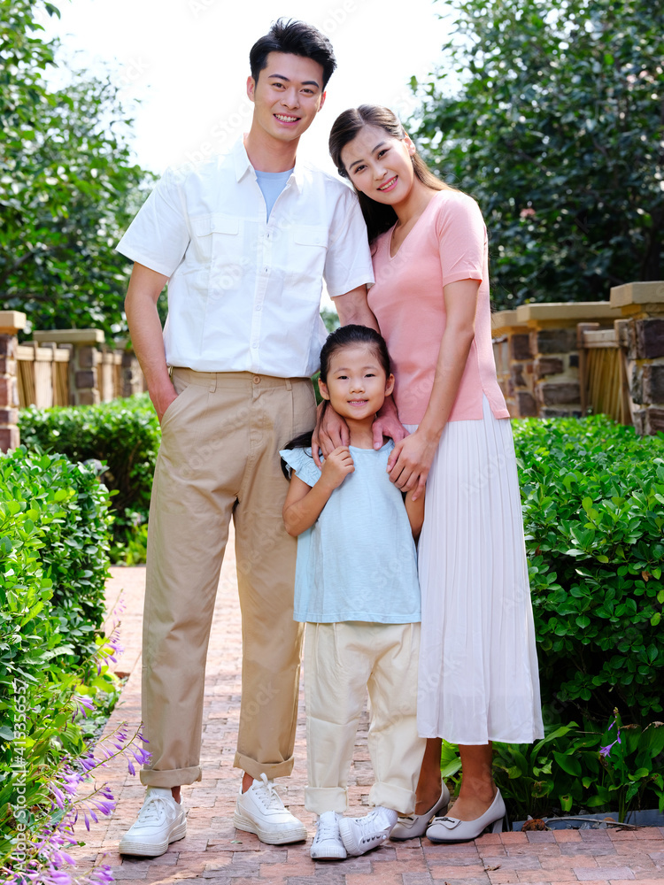 Happy family of three in the outdoor group photo