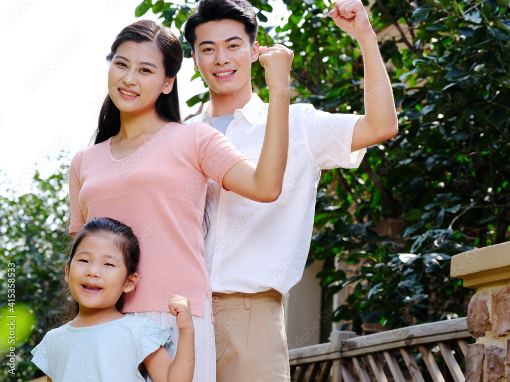 Happy family of three in the outdoor group photo