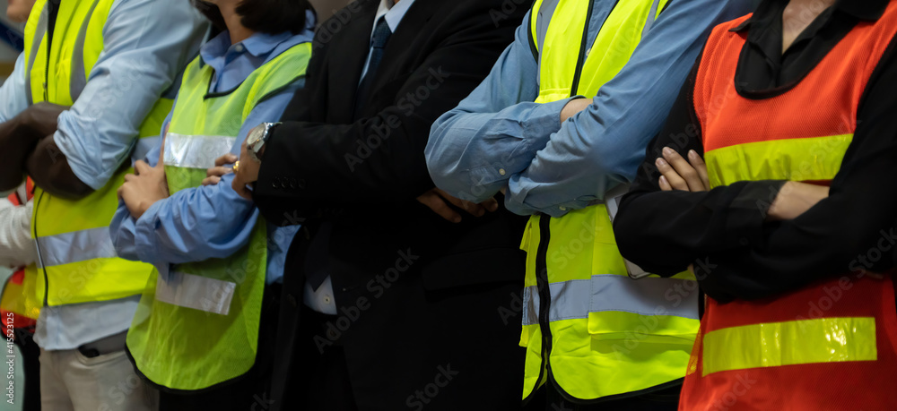 Large group of factory worker standing together in warehouse or storehouse . Logistics , supply chai