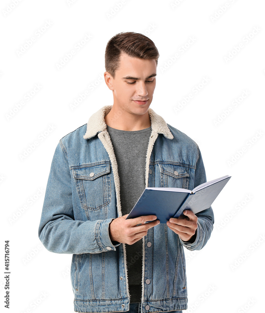 Young man reading book on white background