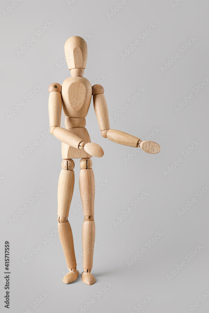 Wooden mannequin on light background