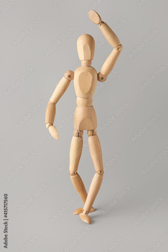 Wooden mannequin on light background