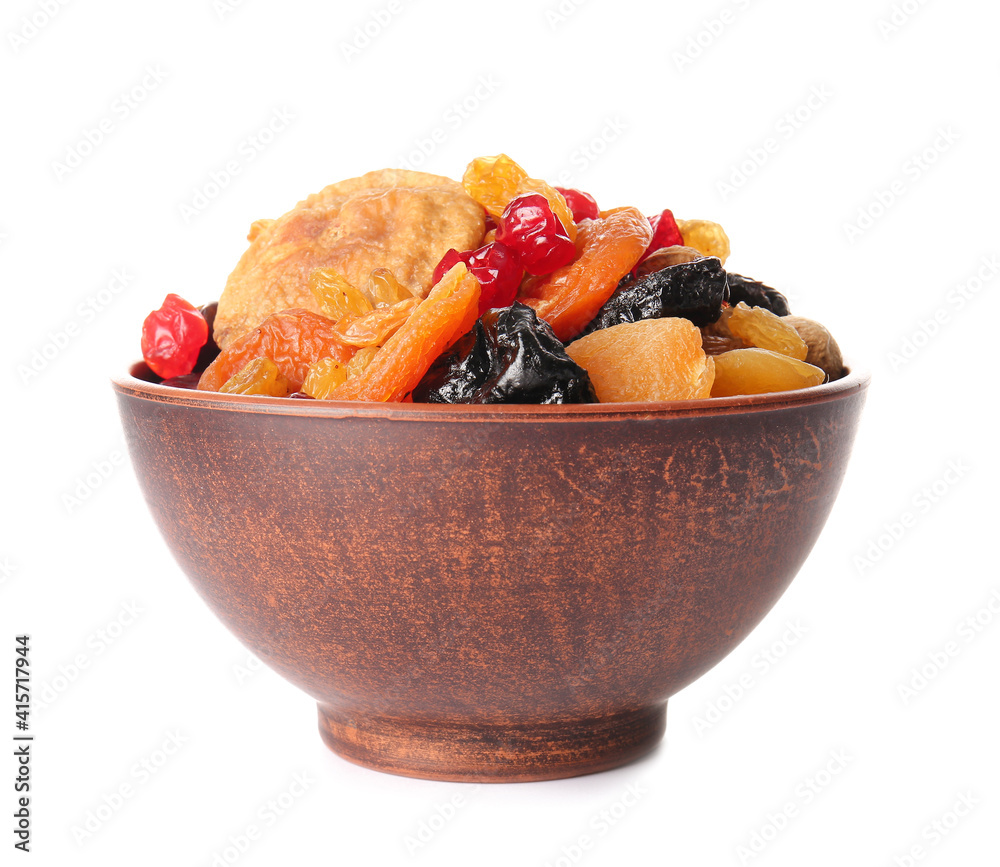 Bowl with different dried fruits on white background