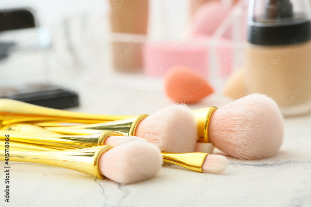 Set of makeup brushes on dressing table, closeup