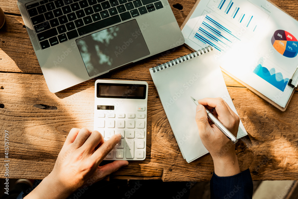 employee accountant man hand press on calculator for make financial report or companys profit month