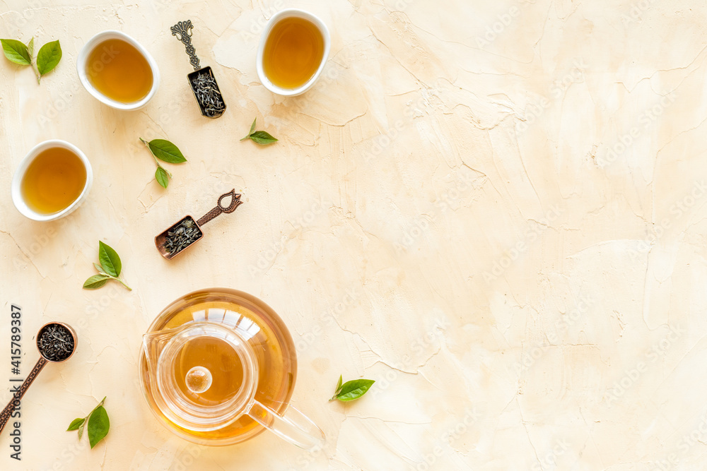 Asian tea ceremony with cups and teapot, top view