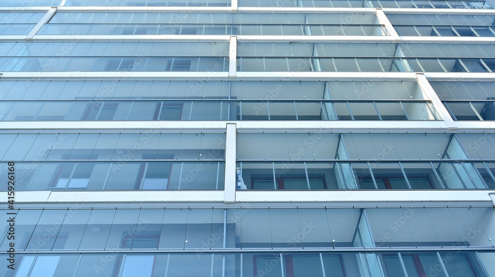 Condominium and apartment building with  symmetrical modern architecture in the city downtown.