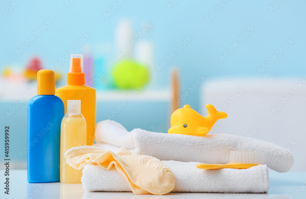 Bath accessories for baby on table in bathroom, closeup