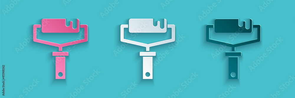 Paper cut Paint roller brush icon isolated on blue background. Paper art style. Vector.