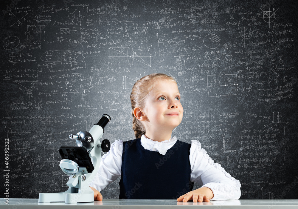 Little girl scientist with microscope