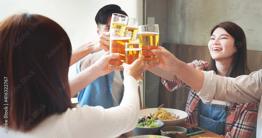 friendship toast beer in restaurant