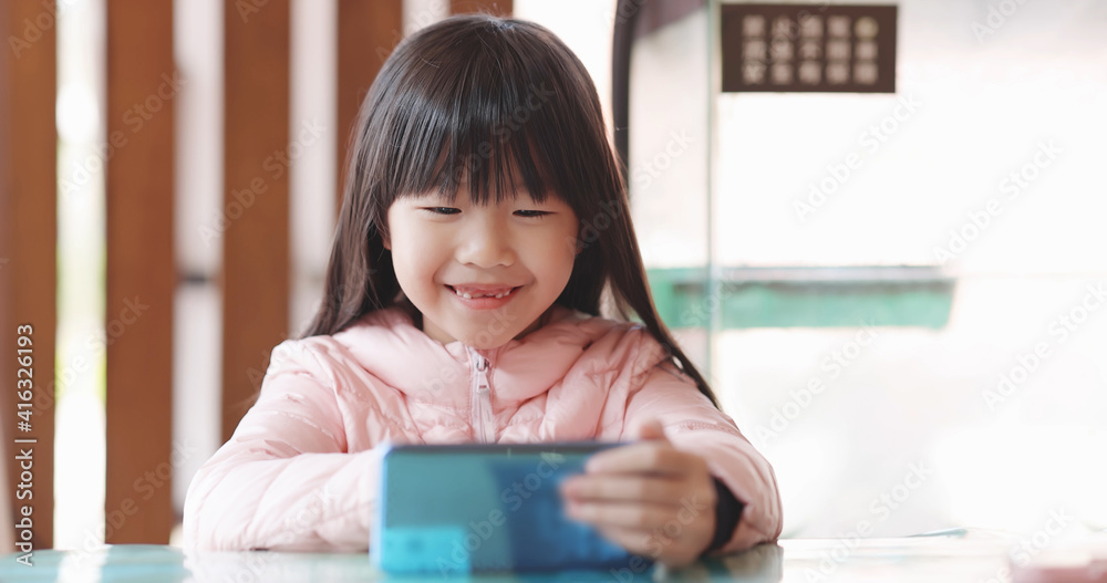 Asian girl uses cell phone