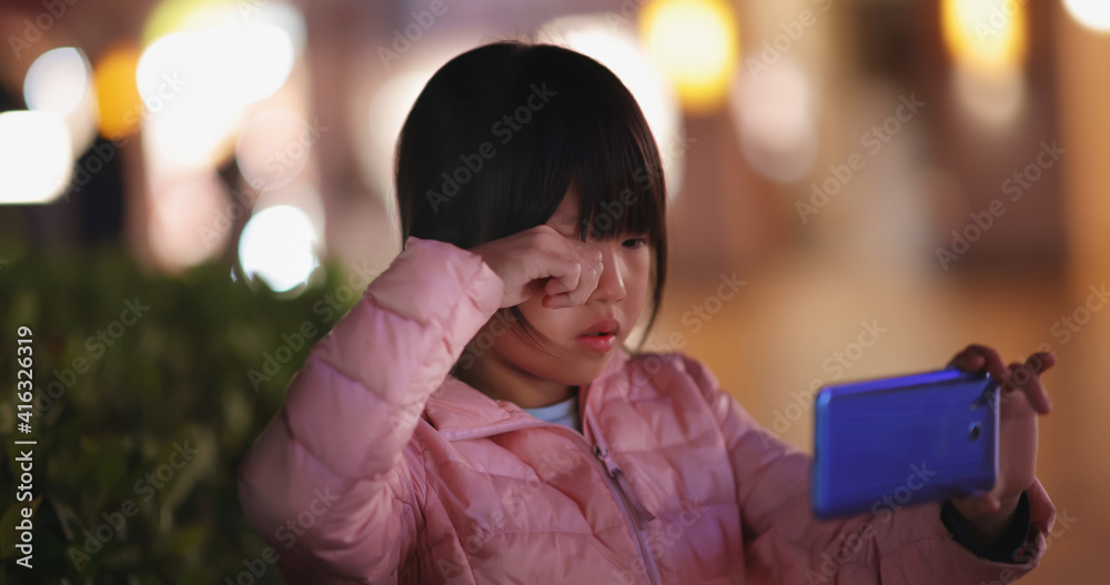 Asian girl uses cell phone