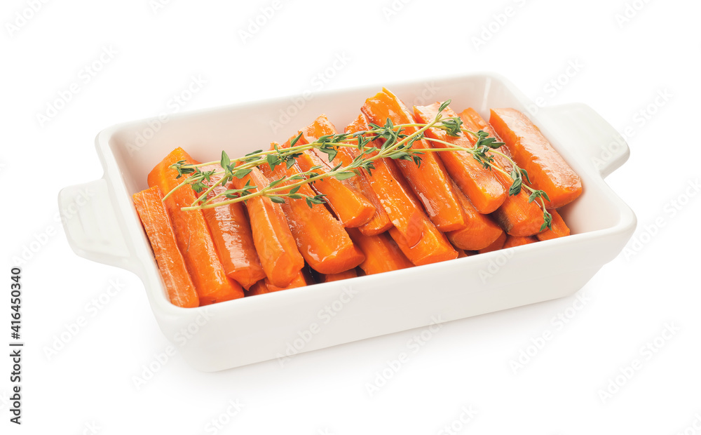 Dish of tasty baked carrot on white background