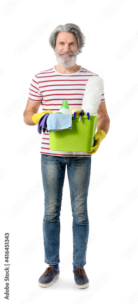 Mature man with cleaning supplies on white background