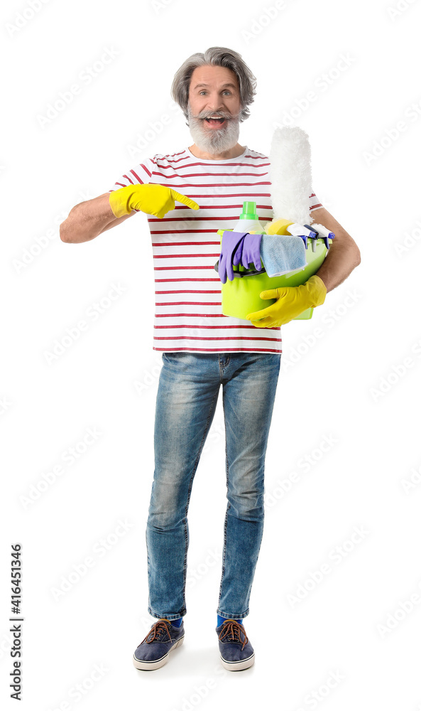 Mature man with cleaning supplies on white background