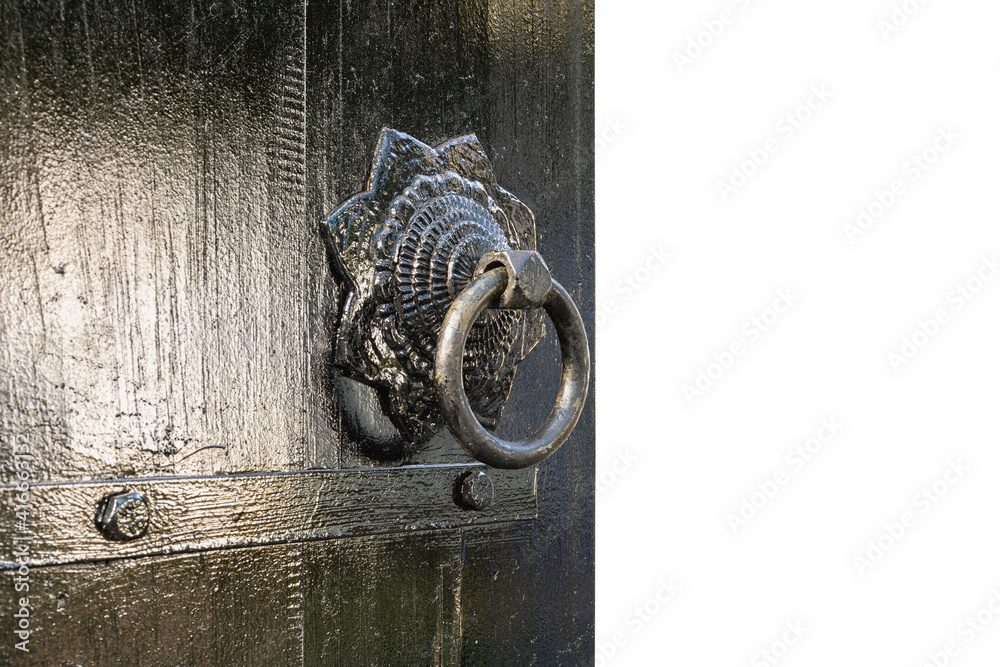 black wooden door and knocker isolated