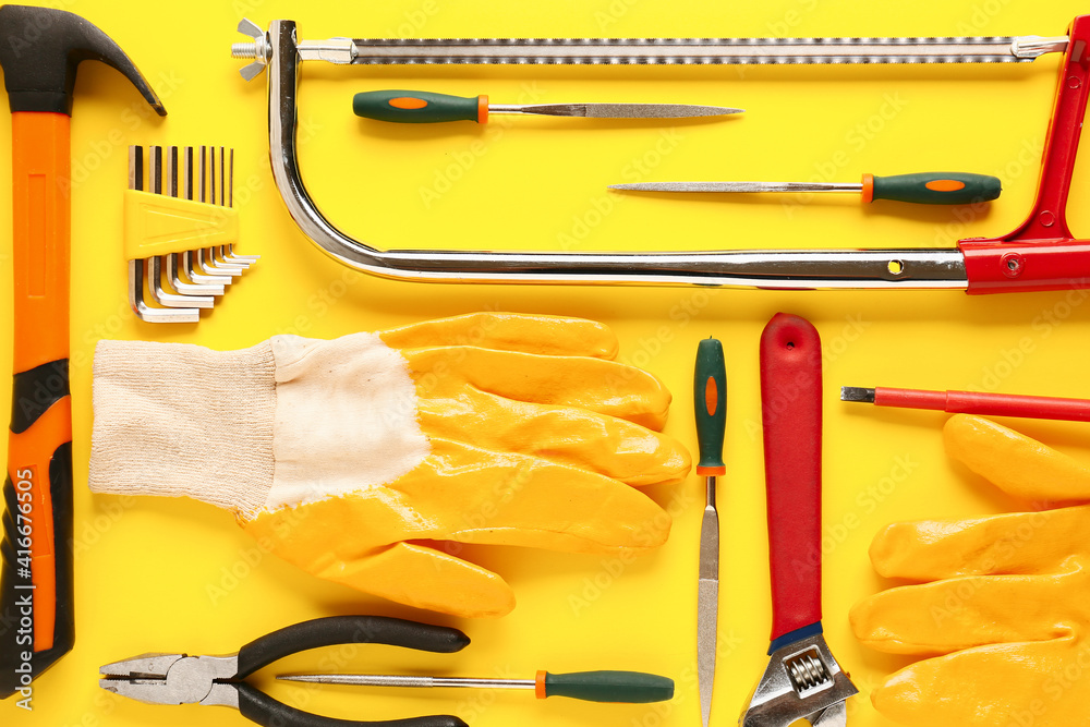 Set of construction tools on color background