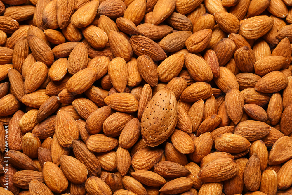 Many tasty almonds as background