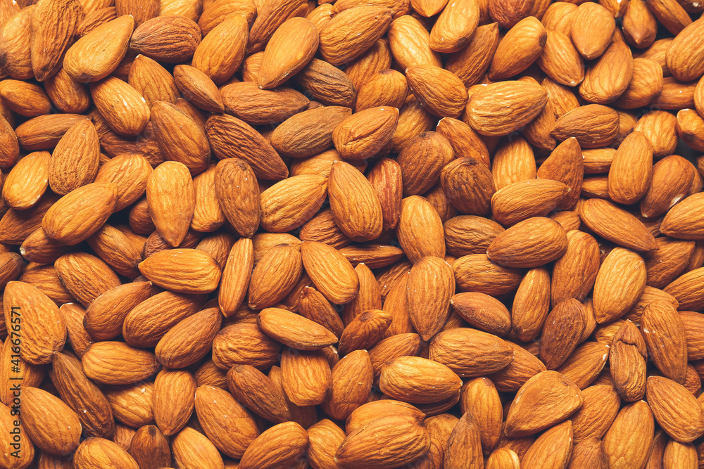 Many tasty almonds as background