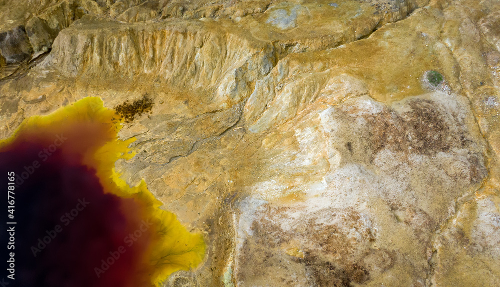 Aerial view of abandoned opencast copper mine in Sia, Cyprus. Unusual colors derives from massive su