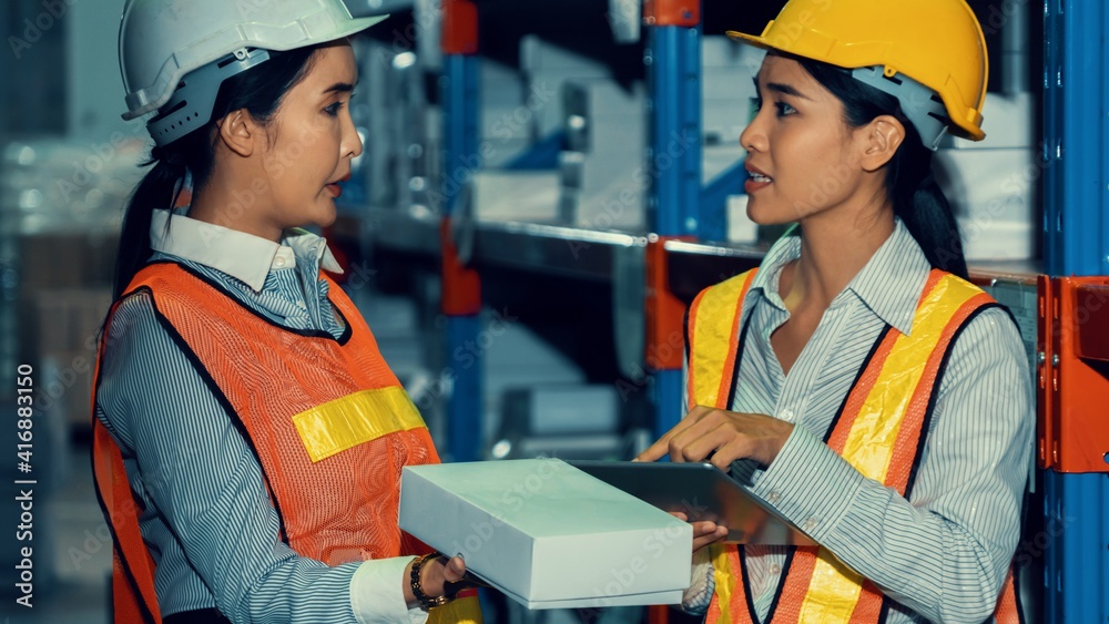 Female warehouse worker working at the storehouse . Logistics , supply chain and warehouse business 