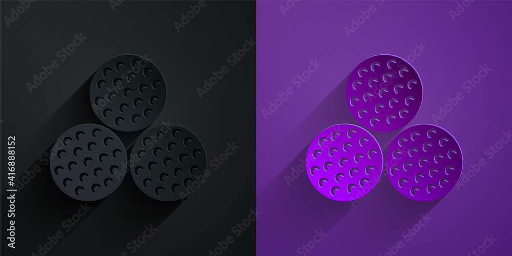 Paper cut Golf ball icon isolated on black on purple background. Paper art style. Vector.