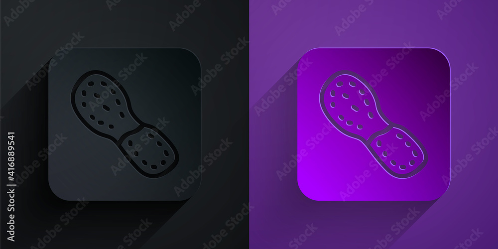 Paper cut Human footprints shoes icon isolated on black on purple background. Shoes sole. Paper art 