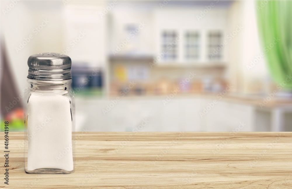 The salt glass bottle on the kitchen desk