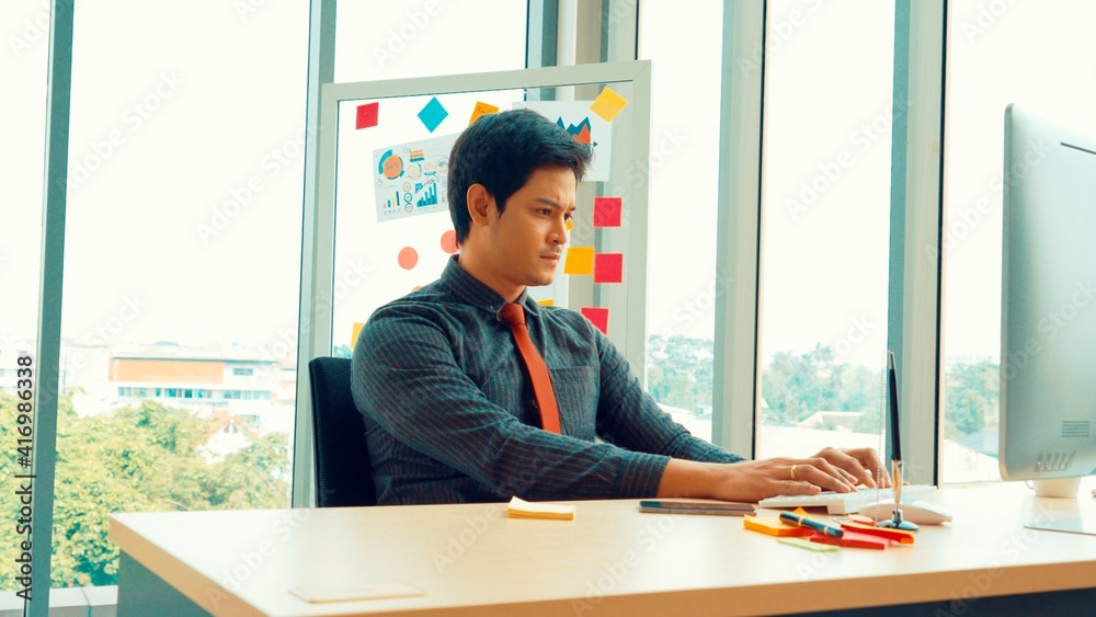 Two business people talk project strategy at office meeting room. Businessman discuss project planni