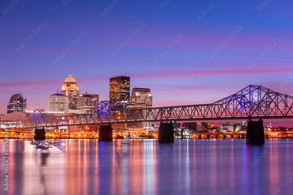 Louisville, Kentucky, USA skyline on the river at dusk.