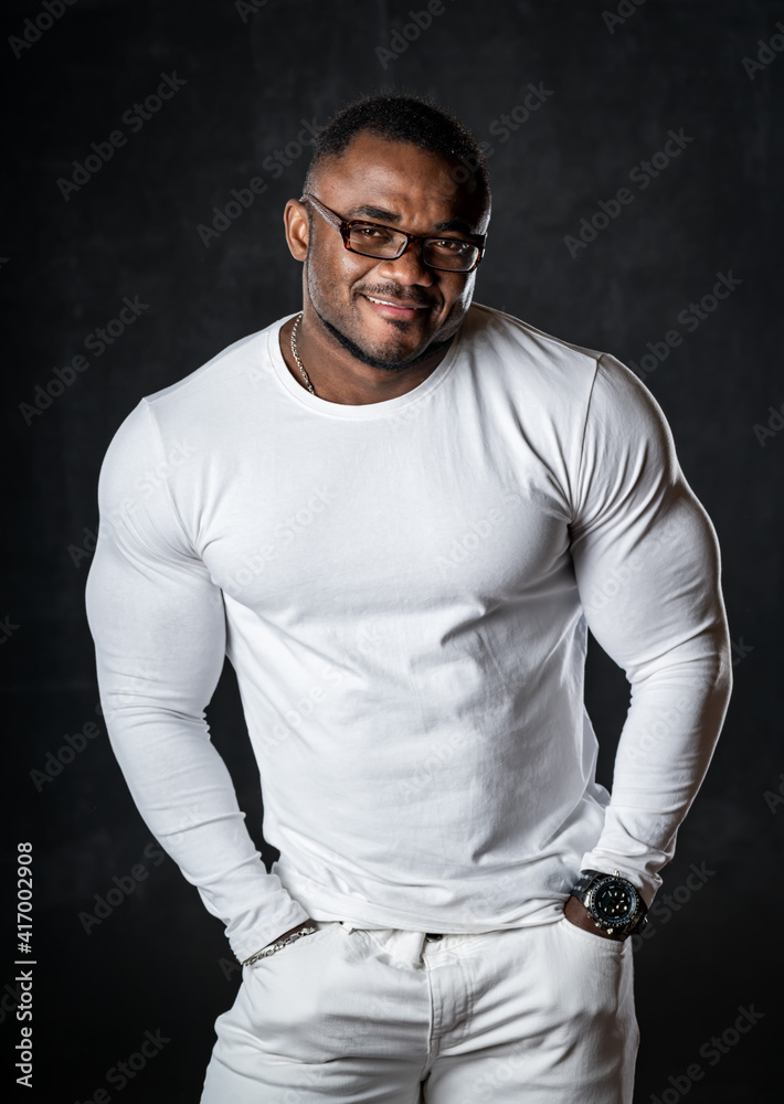 young African American man in studio in glasses