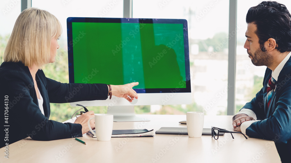 Business people in the conference room with green screen chroma key TV or computer on the office tab