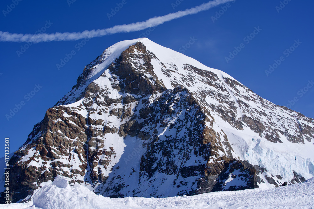 Peak called Mönch (German for monk) seen from Jungfraujoch. Photo taken February 26th, 2021, Switzer