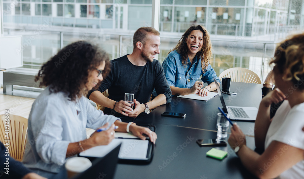 Business people smiling after a productive meeting